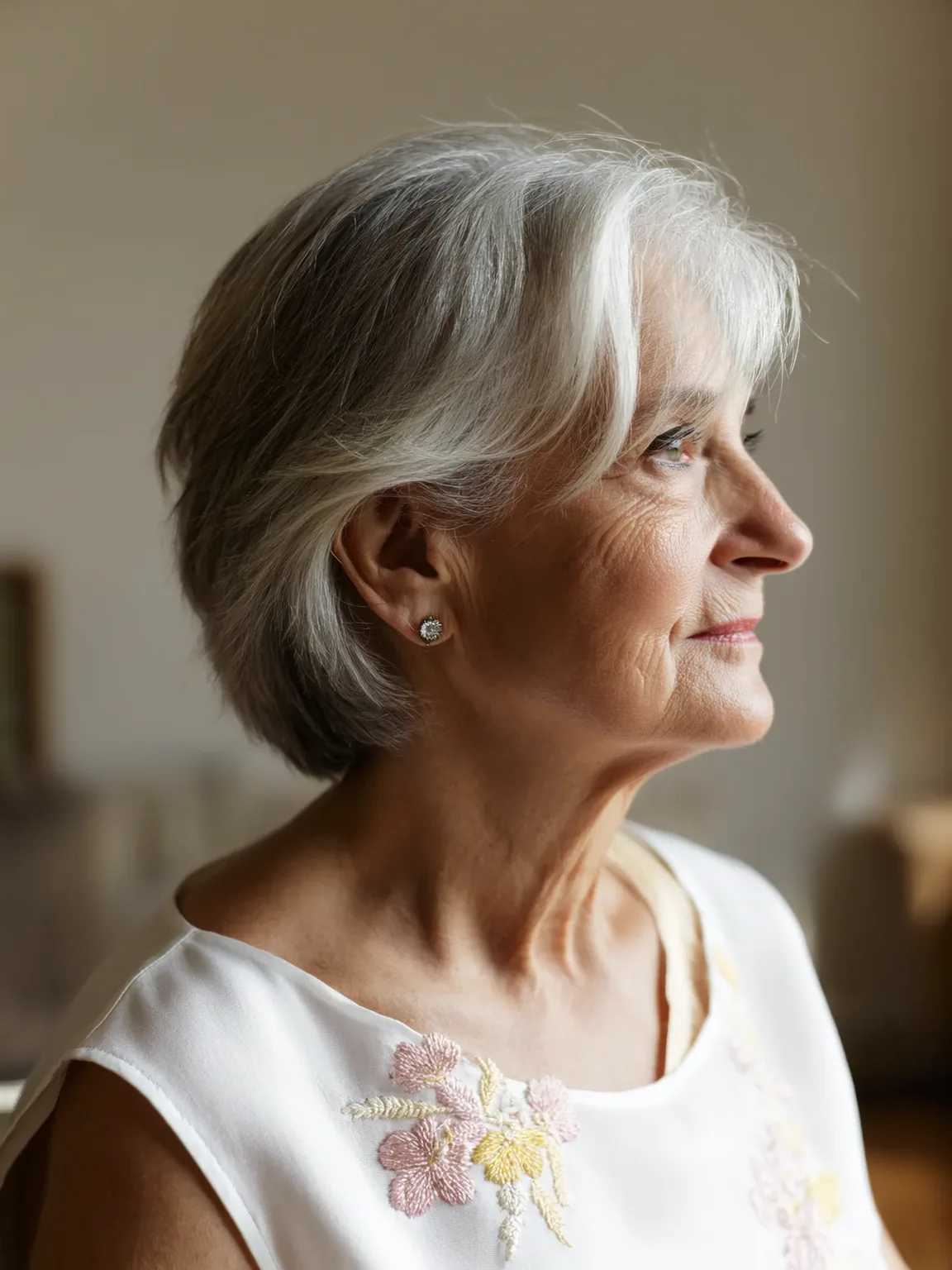 Short Layered Silver Frost Bob with Side-Swept Bangs